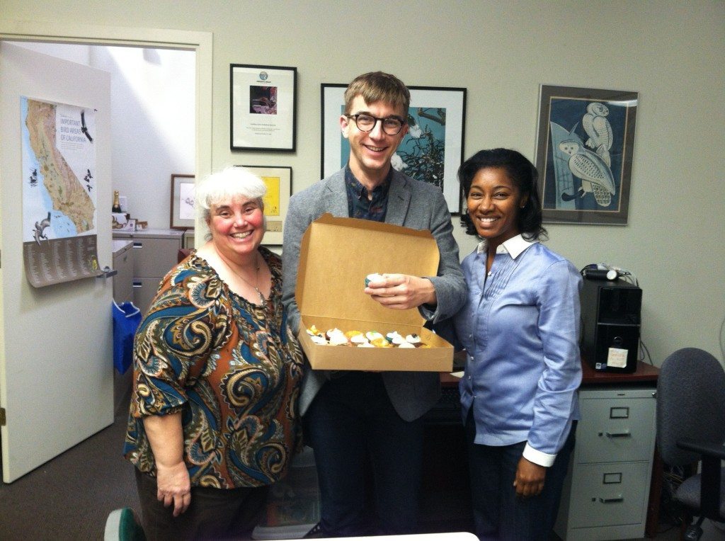 GGBA Executive Director Cindy Margulis (left) shares celebratory cupcakes with Ben Sisson and new Office Manager Monica Moore. Photo by Ilana DeBare.