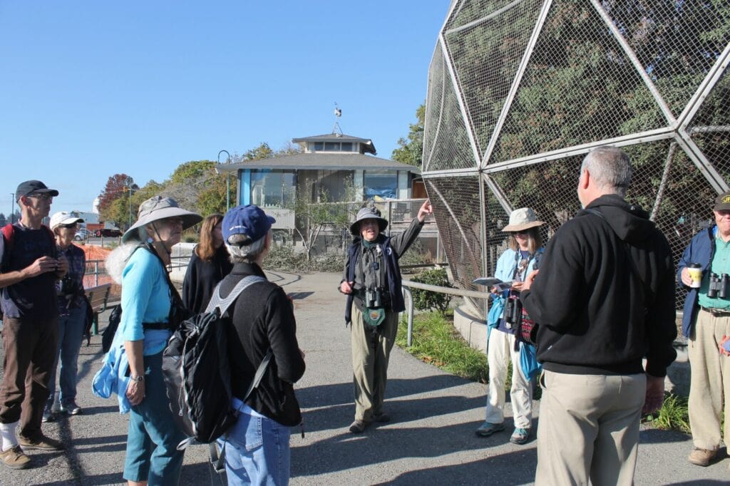 Hilary Powers outside of the Geodesic Bird Dome with a group at Lake Merritt