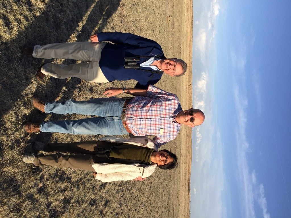 George and Lani with Bo Bledsoe, owner of Bledsoe Ranch, which protects over 100 Prairie-Chicken leks. The land behind them includes the leks.