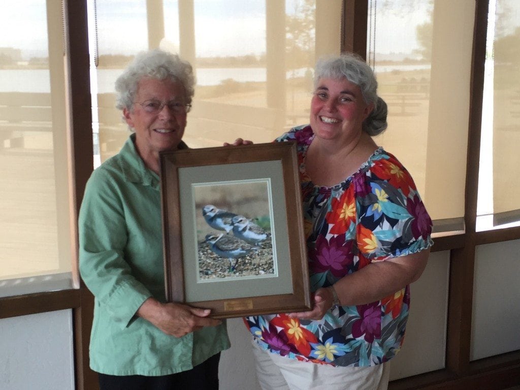 Linda Vallee (left) gets a thank-you gift from GGBA Executive Director Cindy Margulis for her service on the board. Her Board term ended last summer but she continues as a database volunteer. Photo by Ilana DeBare.