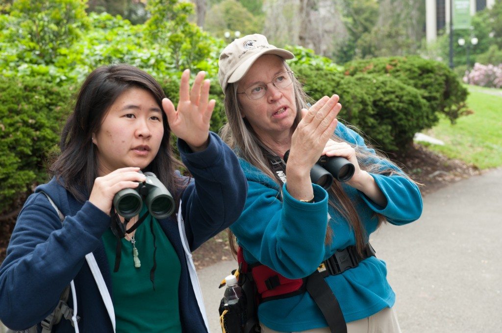 Tiffany Wong and Maureen Lahiff locate a bird / Photo by Peter Maiden